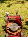 Broken old lawnmower in backyard grass Royalty Free Stock Photo