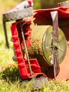 Broken old lawnmower in backyard grass Royalty Free Stock Photo