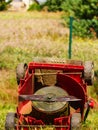 Broken old lawnmower in backyard grass Royalty Free Stock Photo