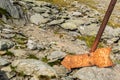 Broken old rusty arrow sign in the mountains Royalty Free Stock Photo