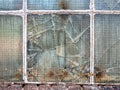 Broken old window glass in warehouse. Royalty Free Stock Photo