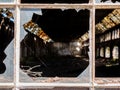 Broken old window glass in warehouse. Royalty Free Stock Photo
