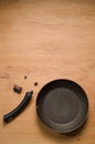 Broken Pan Handle on Wooden Table Royalty Free Stock Photo