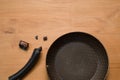 Broken Pan Handle on Wooden Table Royalty Free Stock Photo