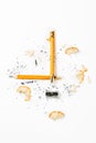 Broken pencil with metal sharpener and shavings. Royalty Free Stock Photo