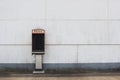 Broken Phone Booth on Empty Wall of Abandoned Building Royalty Free Stock Photo