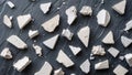 Top-down texture of chalk pieces broken and scattered across textured slate surface Royalty Free Stock Photo