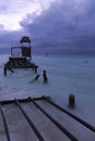 Broken Pier and Approaching Storm