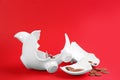 Broken piggy bank with money on red Royalty Free Stock Photo