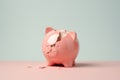 Broken piggy bank on pink and blue background with copy space Royalty Free Stock Photo