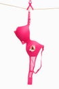 Broken pink bra &ribbon for breast cancer Royalty Free Stock Photo