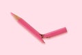 Broken pink colored pencil - Concept of violence against women Royalty Free Stock Photo