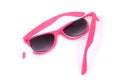 Broken pink sunglasses.