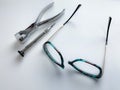 broken plastic glasses. optical workshop. glasses repair tools.