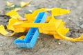 A broken plastic toy lies on the ground. Broken car without wheels Royalty Free Stock Photo