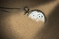 Broken Pocket Watch in the Sand Royalty Free Stock Photo