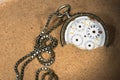 Broken Pocket Watch in the Sand Royalty Free Stock Photo