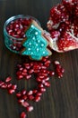 Broken Pomegranate, Seeds and Gingerbread Xmas Tree Cookie Royalty Free Stock Photo