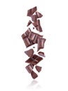 Broken porous dark chocolate fall down on white background