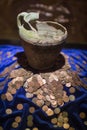 broken pot with coins