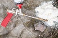 Broken professional spray gun for insulating foam with balloon on concrete floor. Top view.