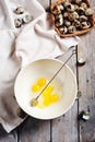 Broken quail eggs in a bowl Royalty Free Stock Photo