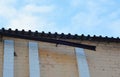 Broken Rain Gutters. Close up on roof gutter ice dam. Icicles damage rain gutter pipeline