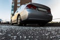 Broken rear glass of car, spread fragments of glass on asphalt Royalty Free Stock Photo