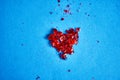 Broken red heart of a Lollipop on a blue background Royalty Free Stock Photo