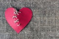 A broken red heart. Sewn thread. The concept of divorce, separation. Royalty Free Stock Photo