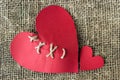 A broken red heart. Sewn thread. The concept of divorce, separation. Royalty Free Stock Photo