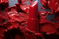 Broken red lipsticks over smudged lipstick background Royalty Free Stock Photo
