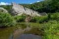 Broken remains of the Austin Dam failure in Austin, Pennsylvania against the trees