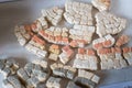 Broken remains of excavated Mosaic floor pieces from a Roman Villa in West Sussex, England