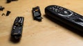 broken remote control, smashed, broken and obsolete television control. technology used, technological waste Royalty Free Stock Photo