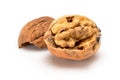 Broken ripe walnut with full kernel, close up macro, isolated on a white background. Royalty Free Stock Photo