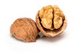 Broken ripe walnut with kernel and shell, close up macro, isolated on a white background. Royalty Free Stock Photo