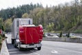 Broken on the road big rig red semi truck with an open hood Royalty Free Stock Photo