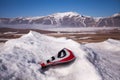 A broken road sign in the snow on the road to arrive in Castelluccio di Norcia, Umbria, Italy