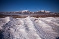 A broken road sign in the snow on the road to arrive in Castelluccio di Norcia, Umbria, Italy