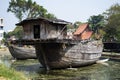 Broken ruins wood chinese sailing ship or damage wooden antique junk boat china style in pond of garden park for thai people
