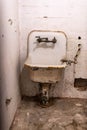 Broken rusty and dirty sink and toilet bowl from a cell at Alcatraz Prison San Francisco California USA Royalty Free Stock Photo