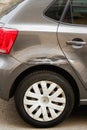 Broken Scratched Rear Fender Car. Scratched With Deep Damage To Paint. Close Up car with a damaged fender is parked on Royalty Free Stock Photo