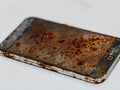 broken screen smartphone. rusty smartphone on the ground Royalty Free Stock Photo
