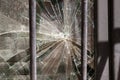 Broken shattered glass behind the window bars Royalty Free Stock Photo