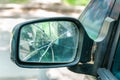 Broken or shattered glass on the rear view side mirror of the car close up with selective focus Royalty Free Stock Photo