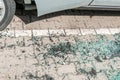 Broken and shattered window or windshield glass on the ground from damaged car Royalty Free Stock Photo