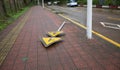 Broken signpost fall down block the road