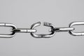 Broken silver metal chain, concept of freedom. Royalty Free Stock Photo
