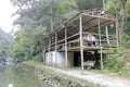 Broken simple house by river, adobe rgb